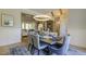 Charming dining room boasting hardwood floors, wood beam features, and neutral decor at 25 Blackhorn Ct, Pittsboro, NC 27312