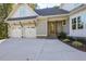 Stylish home featuring a two-car garage and a welcoming front porch at 25 Blackhorn Ct, Pittsboro, NC 27312