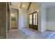 Beautiful home entryway featuring wood floors, a modern light fixture, and wooden beams at 25 Blackhorn Ct, Pittsboro, NC 27312