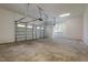 Spacious three-car garage with high ceilings, windows for natural light, and concrete flooring at 25 Blackhorn Ct, Pittsboro, NC 27312