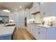 Bright kitchen with stainless steel appliances and white subway tile backsplash at 25 Blackhorn Ct, Pittsboro, NC 27312