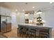 Bright kitchen with stainless steel appliances, an island with seating, and pendant lighting at 25 Blackhorn Ct, Pittsboro, NC 27312