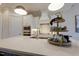 Close-up of a kitchen featuring white cabinets, quartz countertops, and stainless steel appliances at 25 Blackhorn Ct, Pittsboro, NC 27312