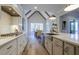 Bright kitchen with stainless steel appliances and island overlooking dining area at 25 Blackhorn Ct, Pittsboro, NC 27312