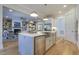 Open kitchen with stainless steel appliances and a breakfast bar overlooking living area at 25 Blackhorn Ct, Pittsboro, NC 27312