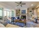 Inviting living room with fireplace, built-in shelves, comfortable seating and view to screened porch at 25 Blackhorn Ct, Pittsboro, NC 27312