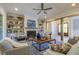 Bright living room featuring a fireplace, built-in shelves, and an open entryway with wood accents at 25 Blackhorn Ct, Pittsboro, NC 27312