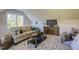 Bonus room with a comfortable sofa, an entertainment center, and a patterned rug creating a cozy atmosphere at 25 Blackhorn Ct, Pittsboro, NC 27312