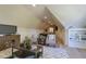 Bonus room with a foosball table, comfortable seating, and hardwood floors, perfect for entertaining guests at 25 Blackhorn Ct, Pittsboro, NC 27312