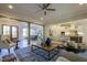 Open-concept view of the living room, dining area, and kitchen with stainless steel appliances at 25 Blackhorn Ct, Pittsboro, NC 27312