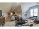 Bonus room featuring a foosball table, entertainment center, hardwood floors, and stylish seating at 25 Blackhorn Ct, Pittsboro, NC 27312