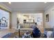 View of living room with hardwood floors, a comfortable sofa and open kitchen with stainless appliances at 25 Blackhorn Ct, Pittsboro, NC 27312