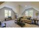 Bright bonus room with plenty of natural light and stylish decor, creating an inviting space to relax and unwind at 25 Blackhorn Ct, Pittsboro, NC 27312