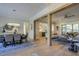Open-concept living and dining area with hardwood floors and decorative wood beam accents at 25 Blackhorn Ct, Pittsboro, NC 27312