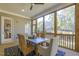 Inviting screened-in porch featuring wood floors, wooded views and a stylish rug creating a cozy atmosphere at 25 Blackhorn Ct, Pittsboro, NC 27312
