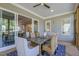 Comfortable screened-in porch with wood floors, wooded views and a stylish rug creating a cozy atmosphere at 25 Blackhorn Ct, Pittsboro, NC 27312