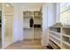 A walk-in closet with custom shelving and storage, adjacent to the Primary bath at 25 Blackhorn Ct, Pittsboro, NC 27312