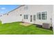 Fenced backyard featuring a small concrete patio with a newly installed lawn at 251 Perseus St, Angier, NC 27501