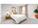 Serene bedroom showcasing a queen-size bed, neutral decor, and a cozy ambiance with ambient lighting at 251 Perseus St, Angier, NC 27501