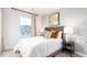 Comfortable bedroom offers soft natural light, with a view of the outdoors at 251 Perseus St, Angier, NC 27501