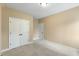 Neutral bedroom featuring carpet, double door closet, and great natural light at 27 Fairwoods Dr, Durham, NC 27712