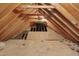 Exposed rafters and beams define this unfinished attic space at 3023 Whitfield Rd, Chapel Hill, NC 27514