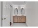 Bathroom with double sink vanity, modern fixtures, and gray tile flooring at 3023 Whitfield Rd, Chapel Hill, NC 27514