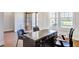 Home office with a large desk, chair, natural light, and beautiful wood floors at 328 Conner Ridge Rd, Efland, NC 27243
