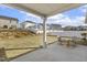 Backyard view from covered patio, with seating area and well maintained lawn at 3333 Sandy Meadows Dr, Fuquay Varina, NC 27526