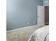 Neutral bedroom with carpet, a door, and blue walls at 3333 Sandy Meadows Dr, Fuquay Varina, NC 27526