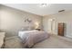Bedroom with a queen-sized bed, a soft rug, and neutral-colored walls, creating a relaxing atmosphere at 3333 Sandy Meadows Dr, Fuquay Varina, NC 27526
