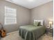 Bedroom featuring a single bed, guitar and side table with lamp at 3333 Sandy Meadows Dr, Fuquay Varina, NC 27526