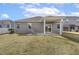 Home's exterior showing patio and well-maintained yard, perfect for outdoor enjoyment at 3333 Sandy Meadows Dr, Fuquay Varina, NC 27526