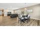 Open floor plan with a dining table set for six, a living room, and a view into the kitchen at 3333 Sandy Meadows Dr, Fuquay Varina, NC 27526