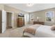 Bright bedroom features soft carpet, neutral walls, and a large window at 3333 Sandy Meadows Dr, Fuquay Varina, NC 27526