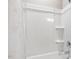 Bathroom features a shower and curtain and shelves to hold products at 3333 Sandy Meadows Dr, Fuquay Varina, NC 27526