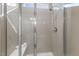 Modern bathroom shower features sleek gray tiles and glass enclosure at 3333 Sandy Meadows Dr, Fuquay Varina, NC 27526