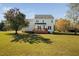 Spacious backyard featuring a deck, perfect for outdoor gatherings and enjoying the serene surroundings at 3648 Praed Pl, Fuquay Varina, NC 27526
