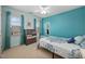 Bedroom featuring bright blue walls, carpet, and natural light from two windows at 3648 Praed Pl, Fuquay Varina, NC 27526