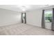 Bedroom featuring white walls, carpet and natural light from two windows at 3648 Praed Pl, Fuquay Varina, NC 27526