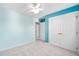 Bedroom featuring bright blue walls, carpet, closet and ceiling fan at 3648 Praed Pl, Fuquay Varina, NC 27526