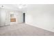Bright bedroom featuring plush carpeting and an open ensuite bathroom, filled with natural light at 3648 Praed Pl, Fuquay Varina, NC 27526