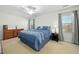 Comfortable bedroom featuring neutral colors and a dresser with visible window and natural light at 3648 Praed Pl, Fuquay Varina, NC 27526