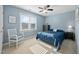 Sun-drenched bedroom featuring a cozy chair, neutral carpet, and a bright window with views at 3648 Praed Pl, Fuquay Varina, NC 27526