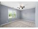 Serene bedroom with ample natural light and neutral colored walls at 3648 Praed Pl, Fuquay Varina, NC 27526