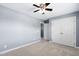 Neutral bedroom featuring ceiling fan, carpet, and closet at 3648 Praed Pl, Fuquay Varina, NC 27526