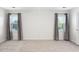 Bedroom featuring white walls, carpet and natural light from two windows at 3648 Praed Pl, Fuquay Varina, NC 27526