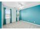 Bright bedroom featuring light blue walls, carpet and natural light from two windows at 3648 Praed Pl, Fuquay Varina, NC 27526