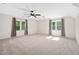 Expansive bonus room with natural light from many windows and neutral carpeting at 3648 Praed Pl, Fuquay Varina, NC 27526
