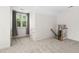 Bright bonus room with neutral carpeting, a window, and staircase access at 3648 Praed Pl, Fuquay Varina, NC 27526